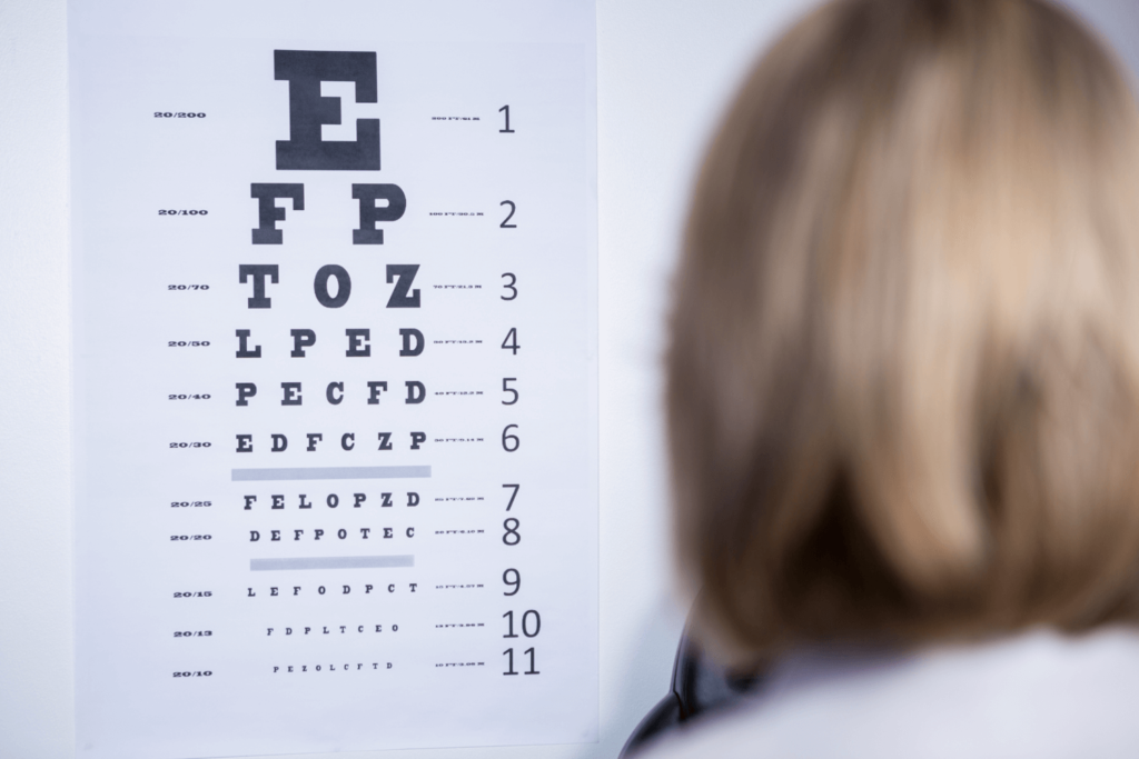 optometrist-looking-at-eye-chart-2021-08-28-22-14-07-utc (1)